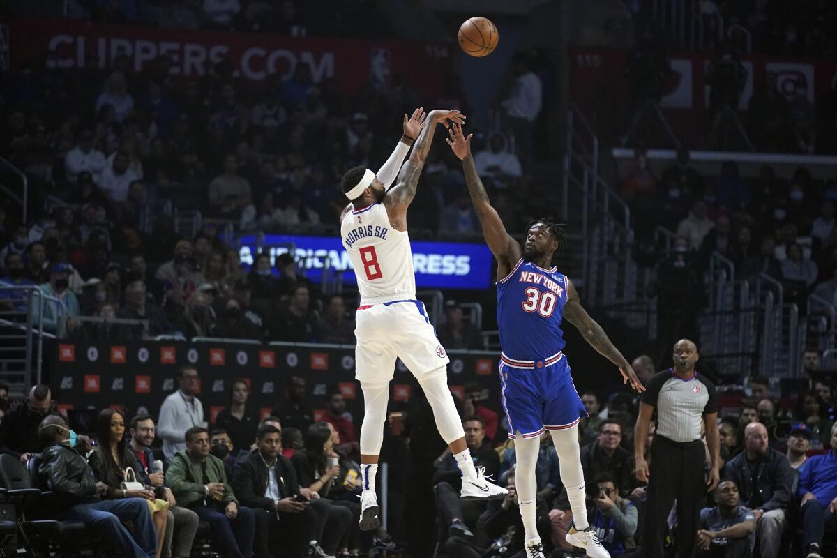 Clippers forward Marcus Morris Sr. shoots over New York Knicks forward Julius Randle during the first half.