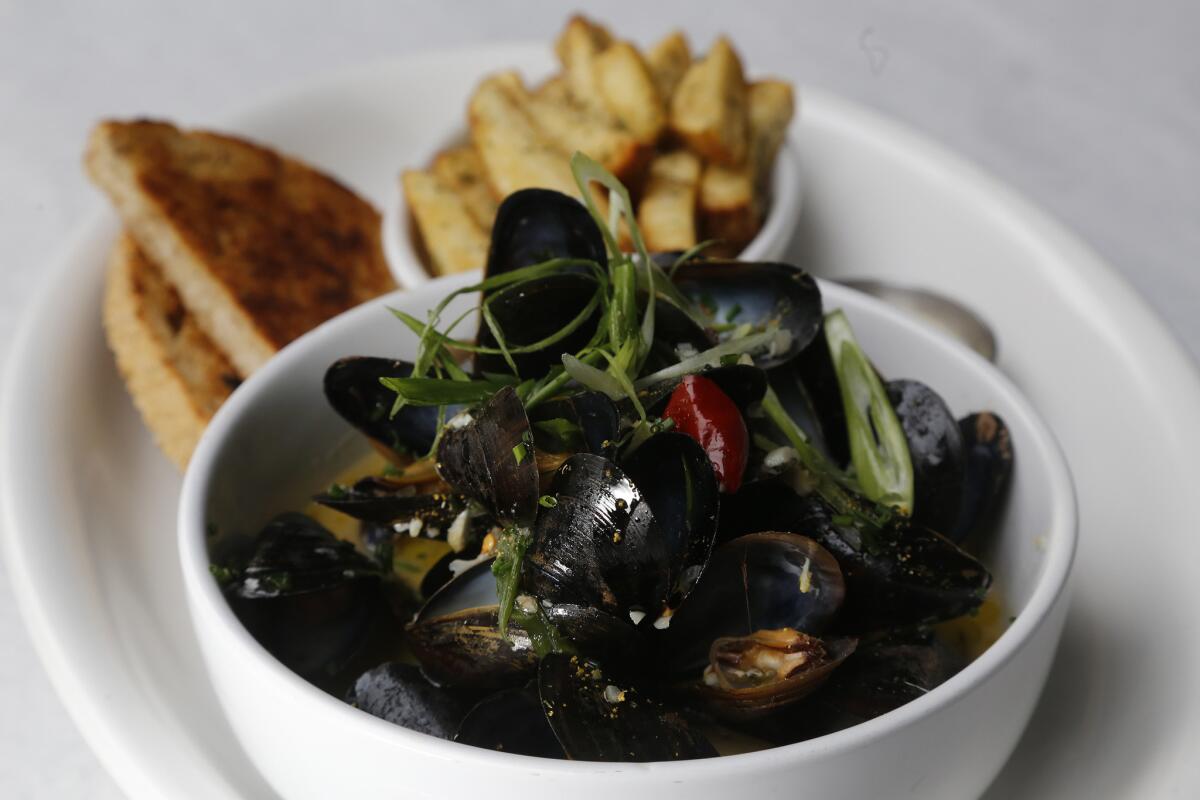 Moules frites with fennel pollen, shallot, cream and garlic.