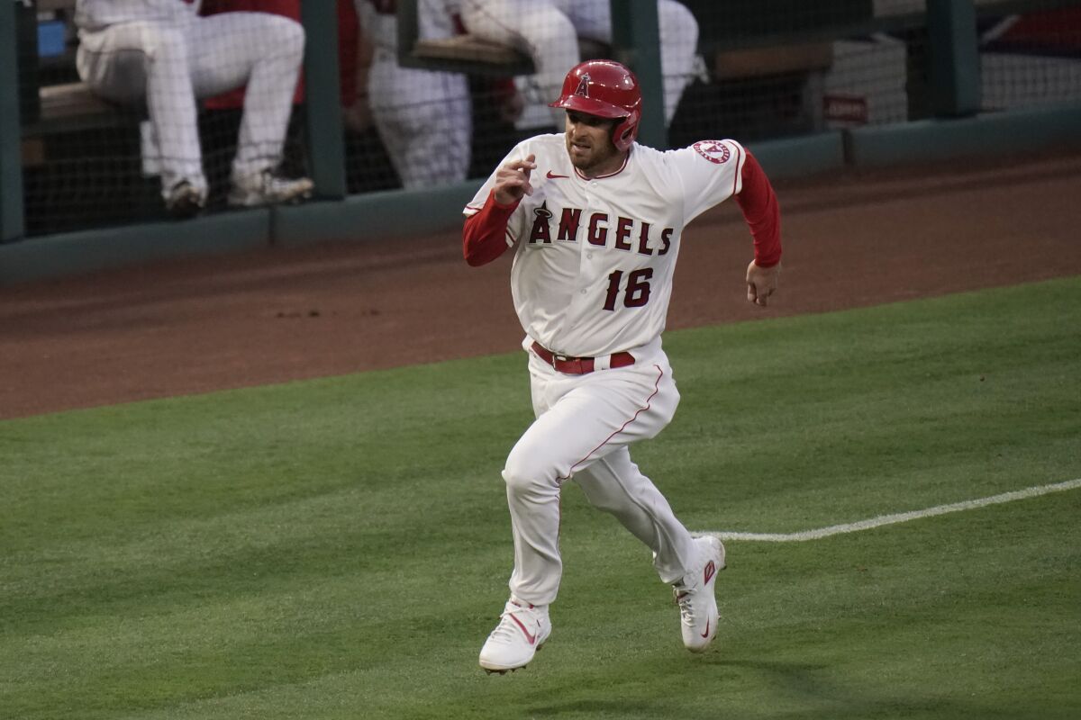Los Angeles Angels' Drew Butera runs toward home to score on a single hit by David Fletcher during the second inning.