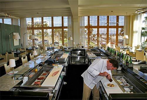 Chef Michael Reardon, of the Catch restaurant in the Casa del Mar, prepares sea bass. The restaurant serves more Santa Monica locals than it does hotel guests.