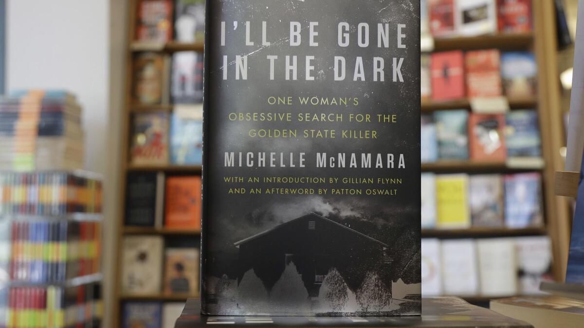 A copy of the book, "I'll Be Gone in the Dark: One Woman's Obsessive Search for the Golden State Killer" by Michelle McNamara.