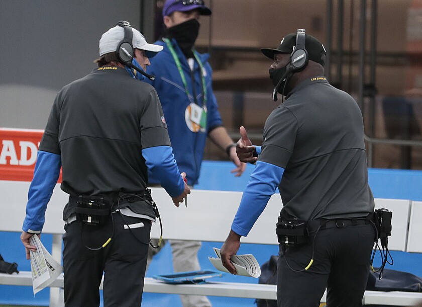 Chargers coach Anthony Lynn, right, has a heated discussion with offensive coordinator Shane Steichen.