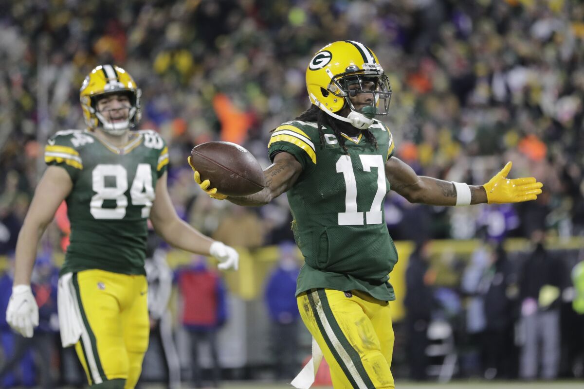 Green Bay Packers' Davante Adams reacts after catchiong a touchdown pass during the first half of an NFL football game against the Minnesota Vikings Sunday, Jan. 2, 2022, in Green Bay, Wis. (AP Photo/Aaron Gash)