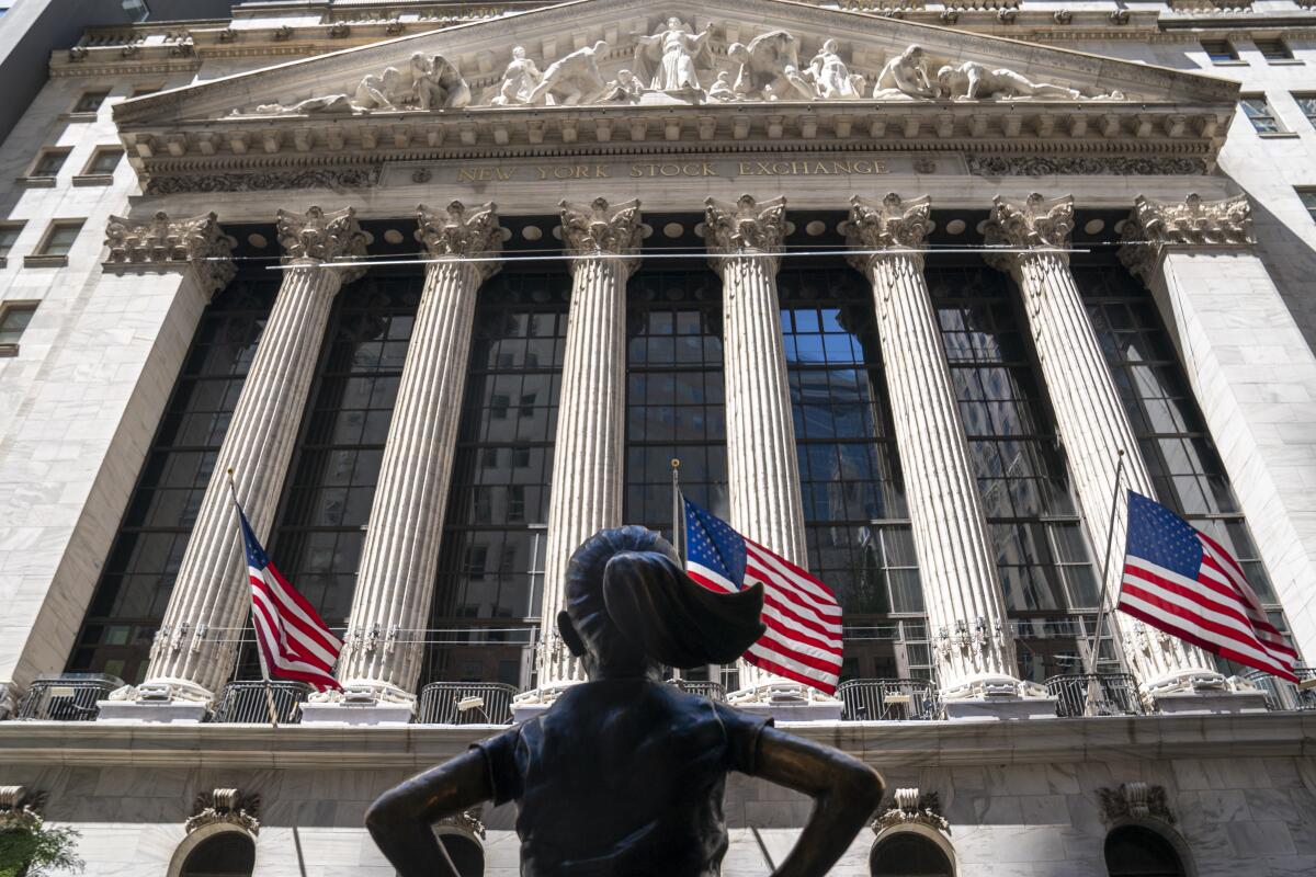 A sculpture faces the New York Stock Exchange building.