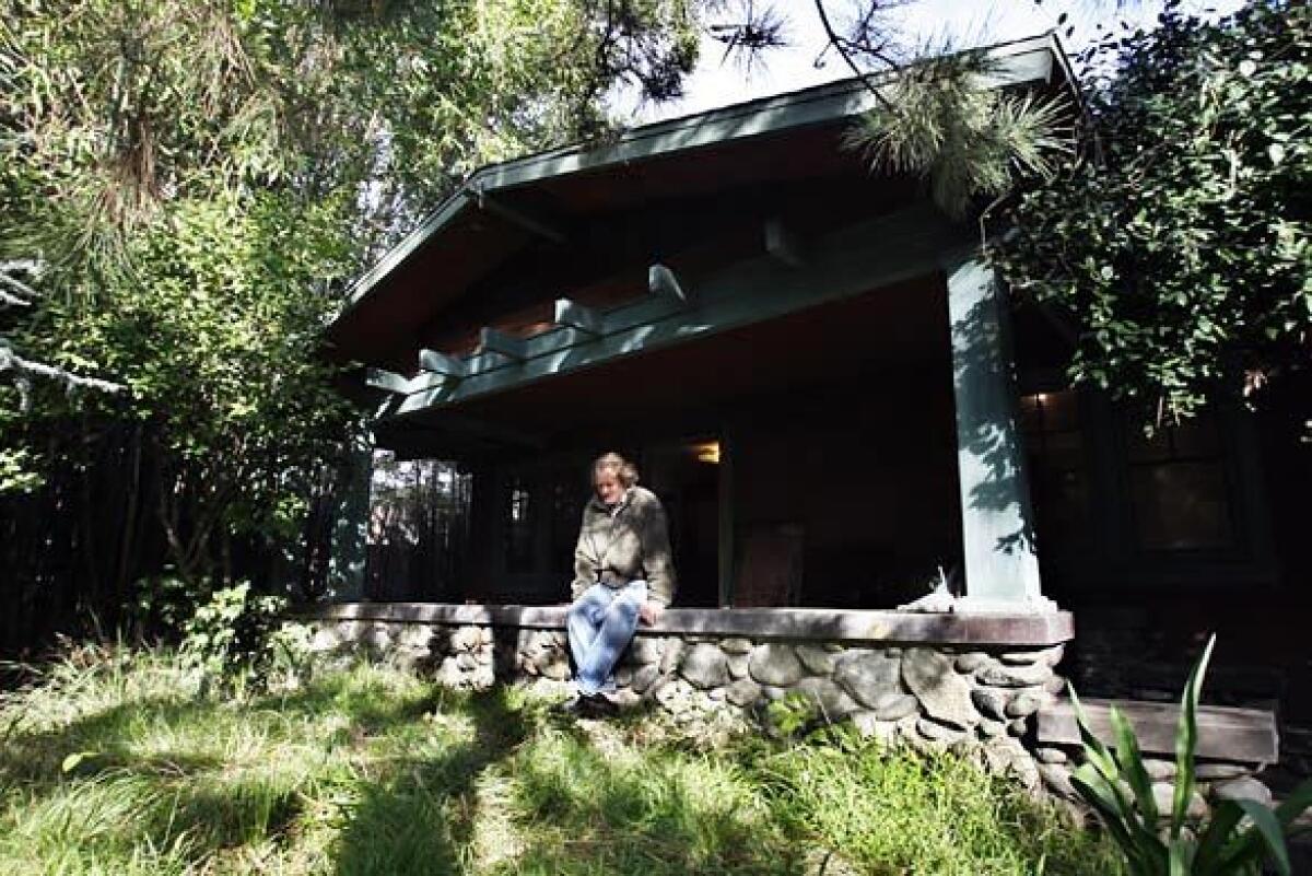 Nestled in a Pomona neighborhood behind a metal and bamboo gate is a magical and otherworldly garden built around this bungalow by garden designer John Greenlee and a man called Simple. A symbol of free-spirited California landscape design, the garden was once a magnet for horticulturists and designers experimenting with plants and landscapes. The garden had a tremendous impact on California gardeners and landscape designers. It demonstrated a freedom of spirit and embraced nature, says West L.A. garden designer Pamela Berstler. Greenlee, who has rented the property since 1977 when he was a college student, is closing the garden this month. The author of the Encyclopedia of Ornamental Grasses now lives in Northern California and continues to visit L.A. for his design work and to manage his nurseries in Chino and Pomona.