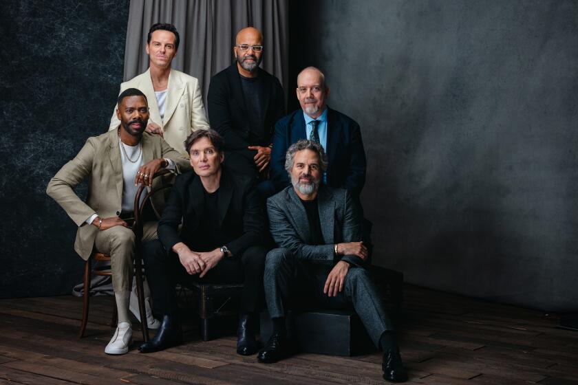 Six acclaimed actors pose together before a dark background with a grey curtain for the 2024 Envelope Actors Roundtable.