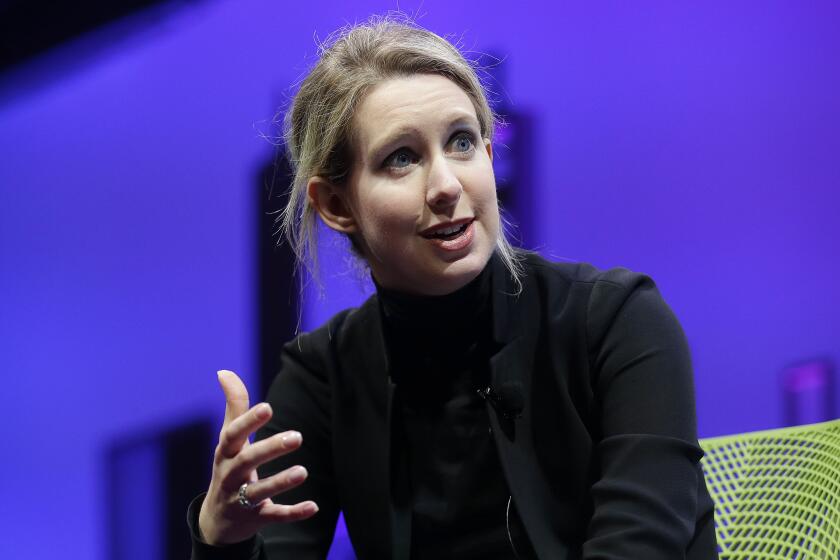 FILE - Elizabeth Holmes, then the CEO of Theranos, speaks at the Fortune Global Forum on Nov. 2, 2015 in San Francisco. As Holmes prepares to report to prison next week, the criminal case that laid bare the blood-testing scam at the heart of her Theranos startup is entering its final phase.(AP Photo/Jeff Chiu, File)