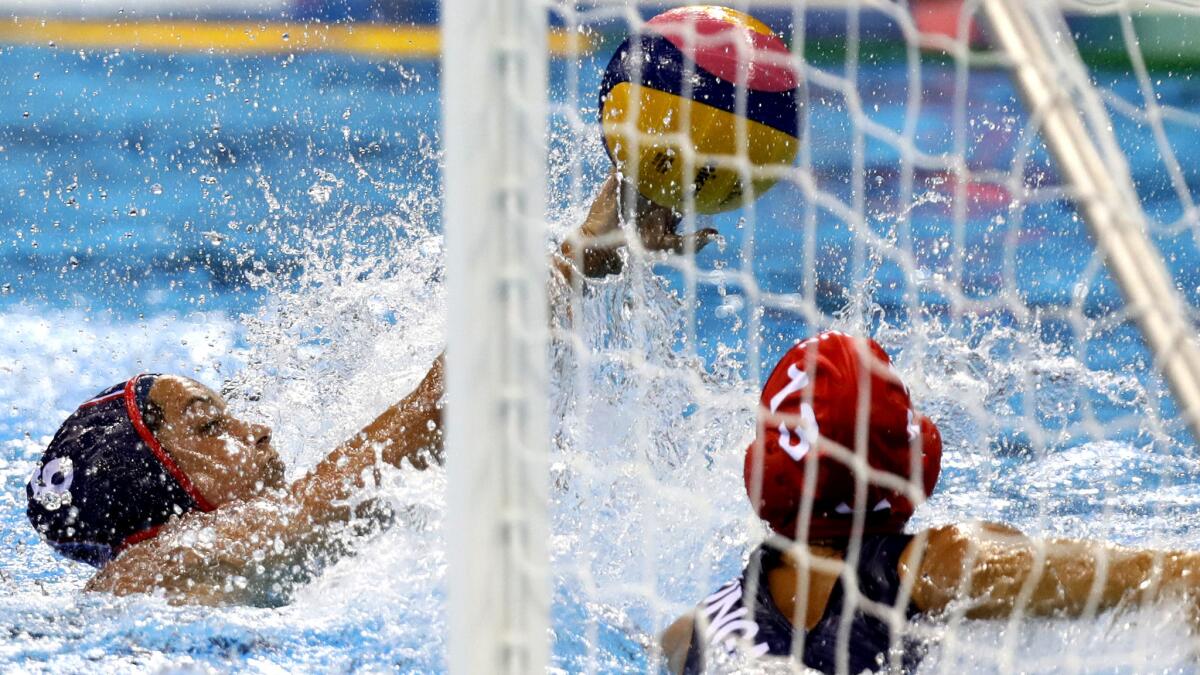 American Maggie Steffens shoots and scores against Hungary during their women's water polo semifinal.