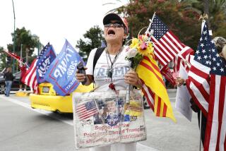 ANAHEIM-CA-SEPTEMBER 29, 2023: Victoria Cooper of Westminster shows her support of former president Donald Trump outside of the California Republican Party Convention at the Anaheim Marriott Hotel on Friday, September 29, 2023. (Christina House / Los Angeles Times)