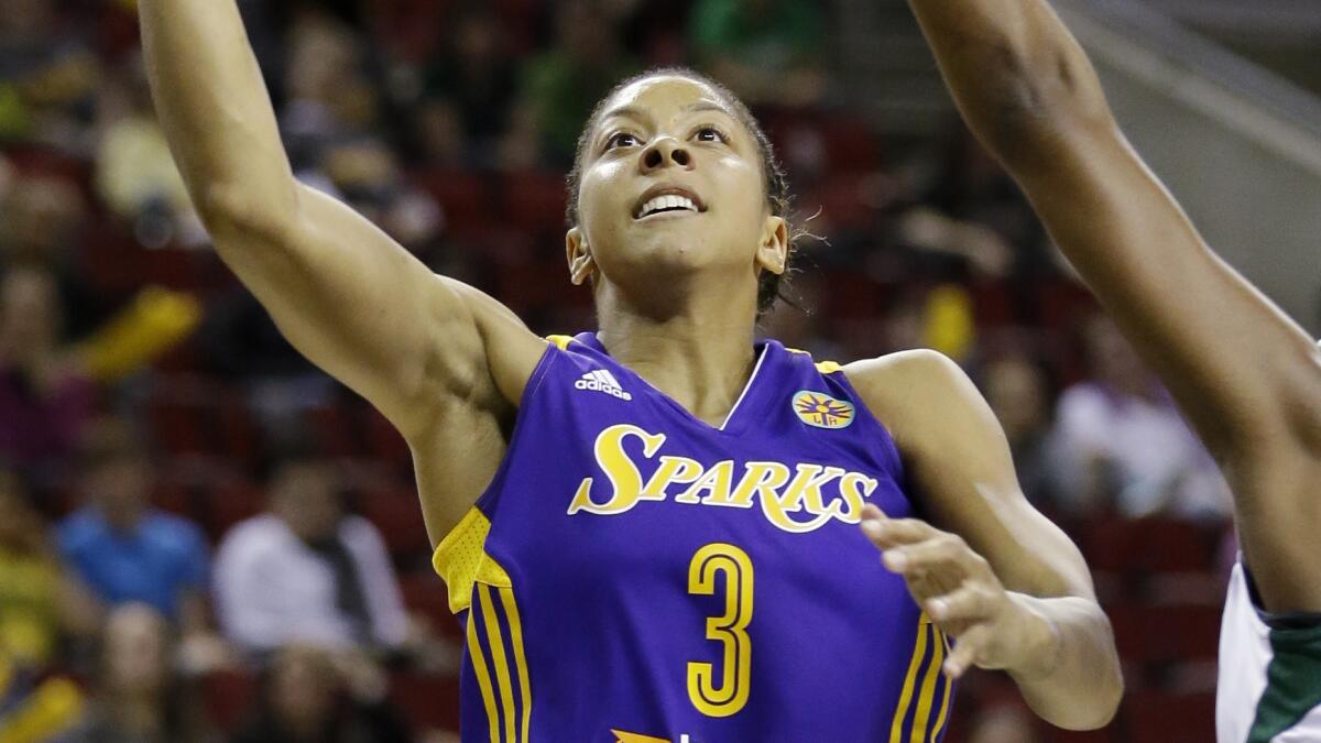 Sparks star Candace Parker puts up a shot during a game against the Seattle Storm in May.