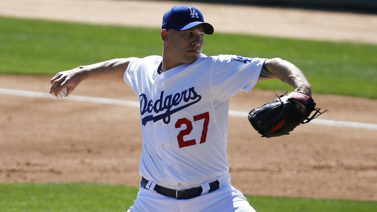 Dodgers reliever Dustin McGowan delivers a pitch in an exhibition game against the Seattle Mariners in Phoenix on March 6.