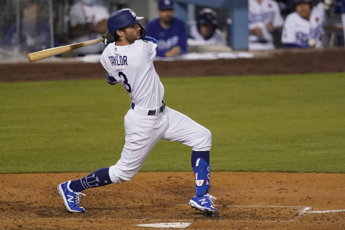 Chris Taylor hits a 14th-pitch, bases-clearing double in the sixth inning for the Dodgers.