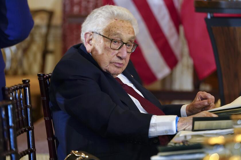 Former U.S. Secretary of State Henry Kissinger attends a luncheon at the State Department in Washington on Dec. 1, 2022.