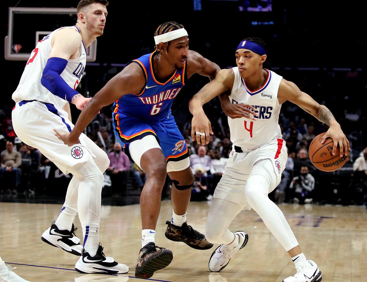 Clippers guard Brandon Boston Jr. drives to the basket against the Thunder guard Melvin Frazier Jr.