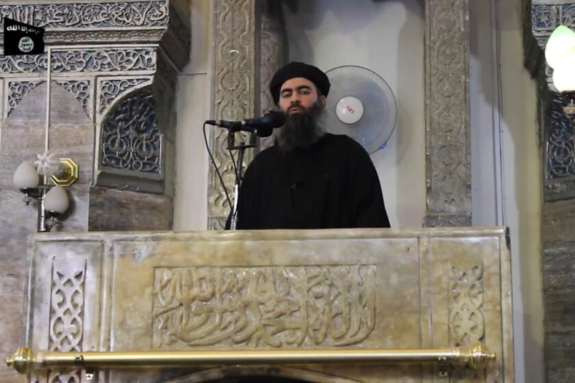The leader of the Islamic State militant group, Abu Bakr al-Baghdadi, addresses worshippers at a mosque in the militant-held northern Iraqi city of Mosul, in this image grab taken from a propaganda video released on in July 2014.