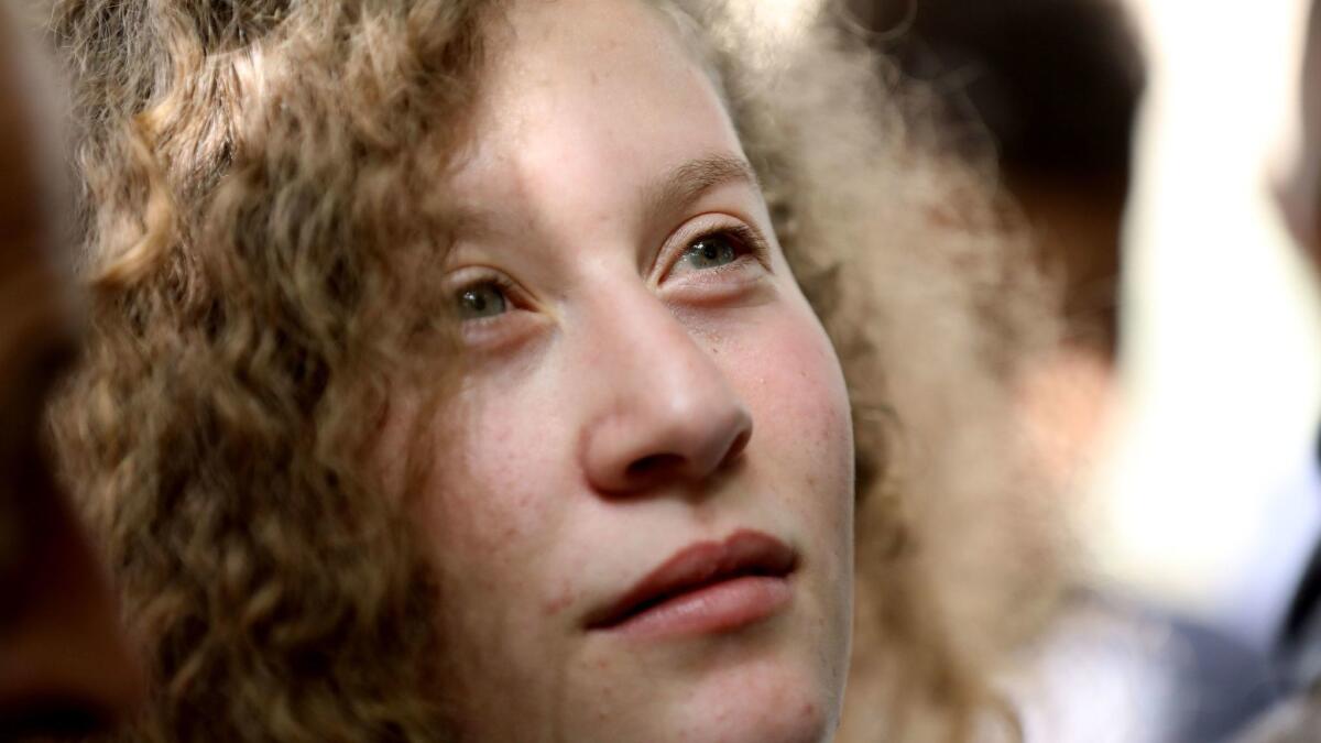 Ahed Tamimi, a 17-year-old Palestinian campaigner against Israel's occupation, is shown after arriving at her village, Nabi Saleh, near the West Bank town of Ramallah, on Sunday.