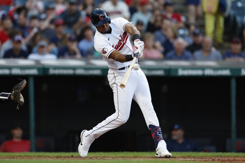 Cleveland Guardians' Oscar Gonzalez hits a double against the Minnesota Twins during the fourth inning in the second baseball game of a doubleheader Tuesday, June 28, 2022, in Cleveland. (AP Photo/Ron Schwane)