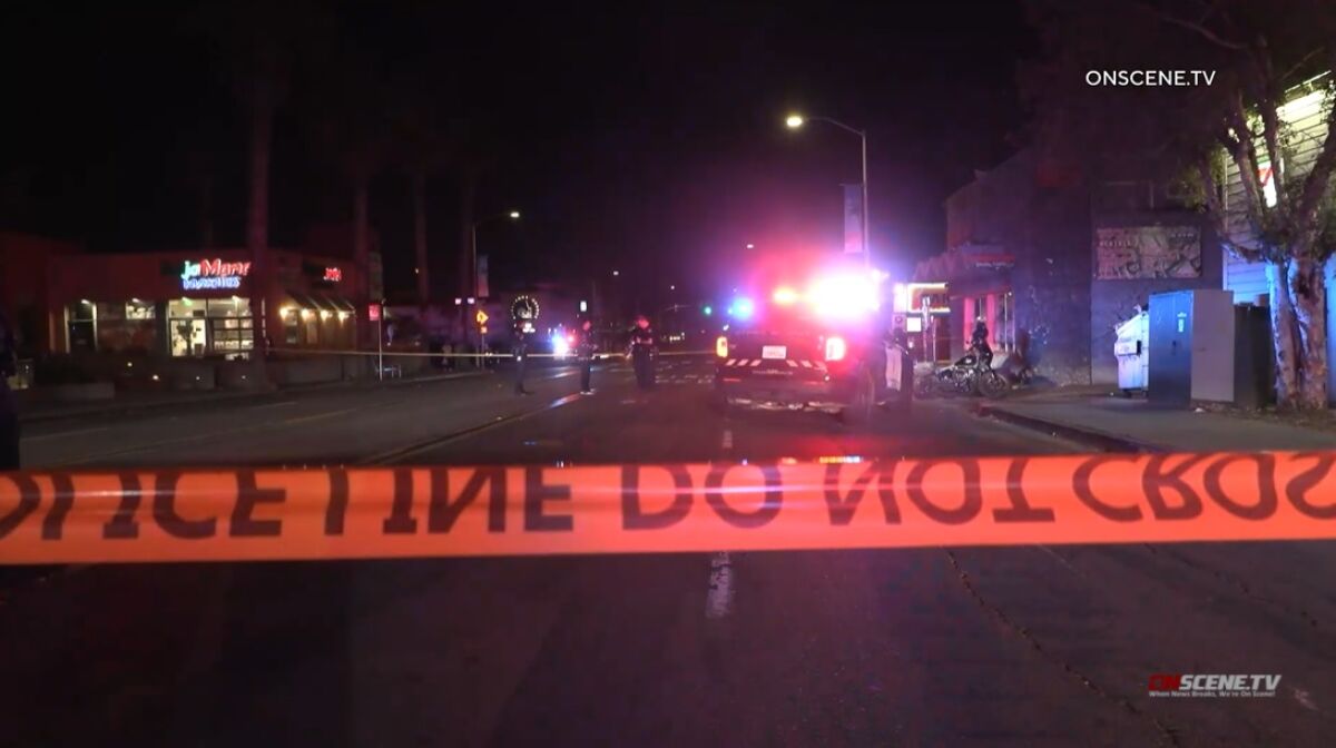 SDPD officers investigate a suspected DUI crash involving a motorcycle rider and pedestrian early Sunday in Pacific Beach.