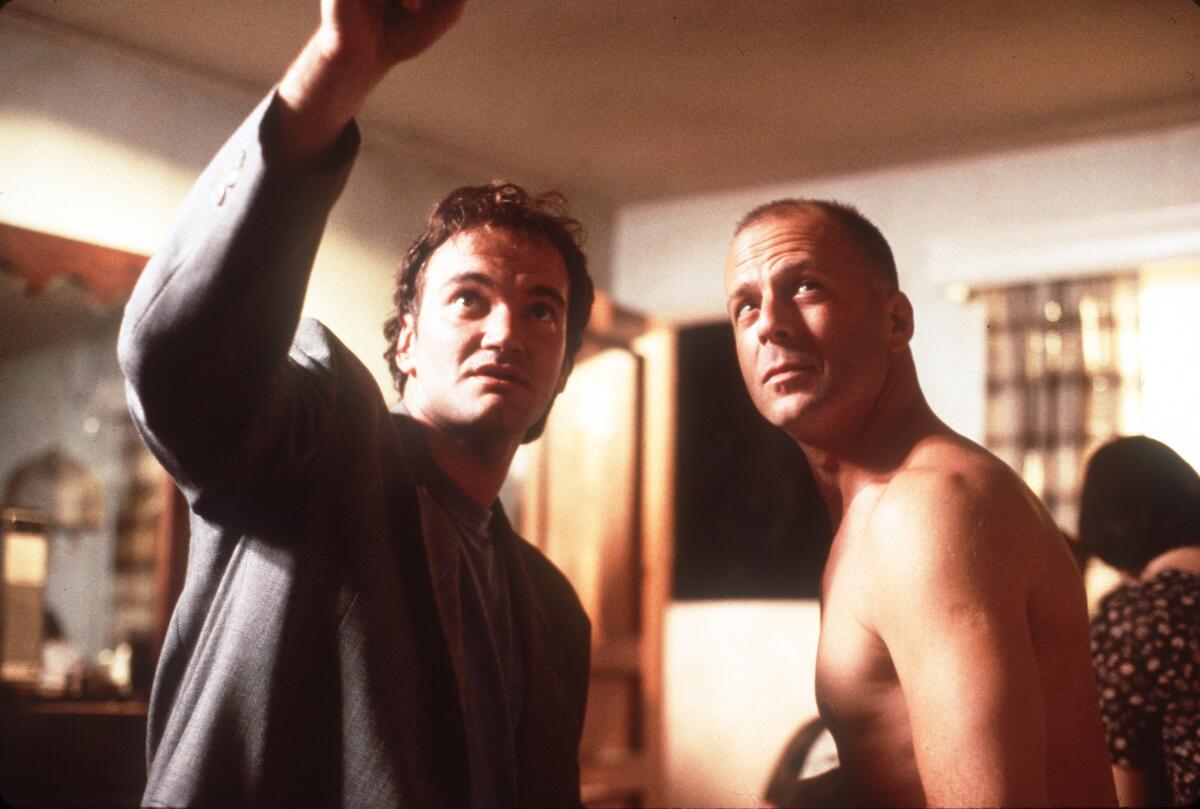 Bruce Willis (right) and Quentin Tarantino (left) on the set of the movie "PulpFiction." 