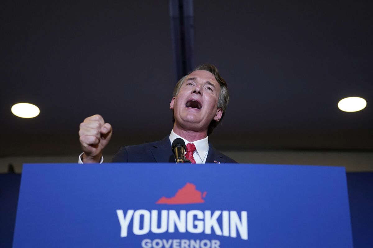Glenn Youngkin speaking at a campaign lectern