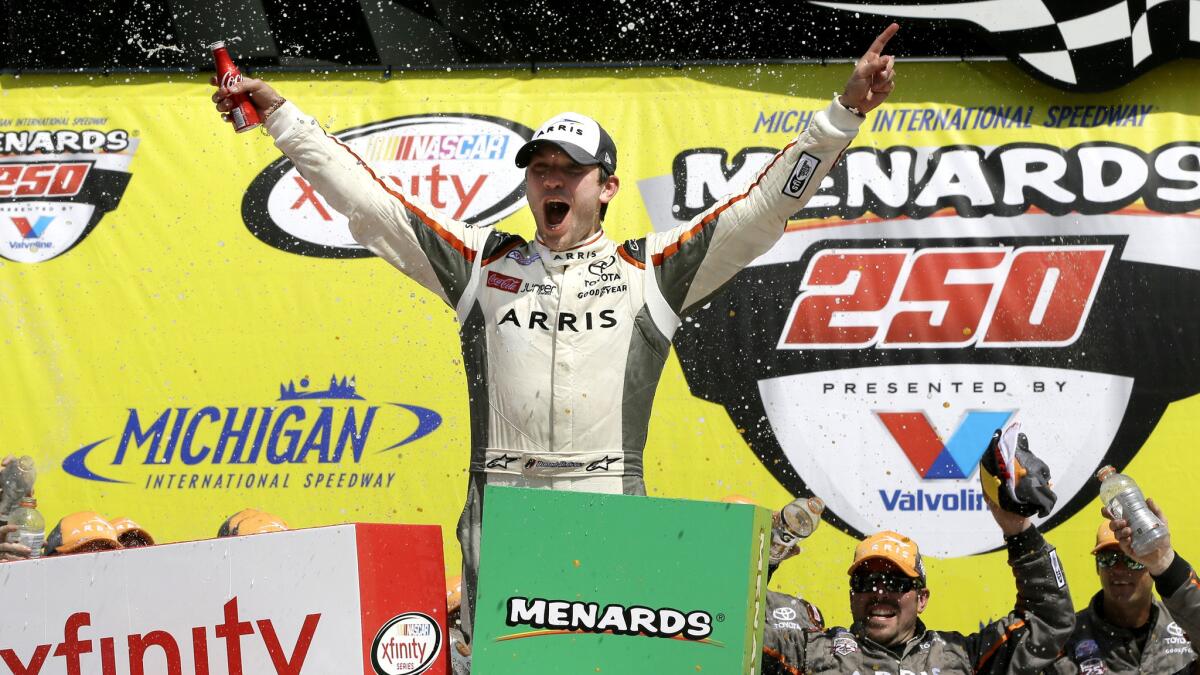 NASCAR driver Daniel Suarez celebrates after winning the Xfinity Series race Saturday at Michigan International Speedway.