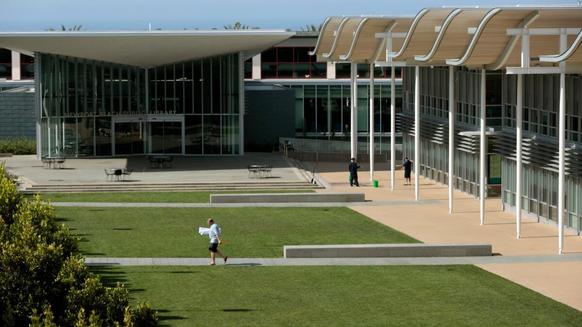 Policies at Newport Beach libraries such as the Central Library, pictured at left, already generally include provisions against threatening or abusive language or gestures, “using restrooms for other than intended purposes” and interfering with other visitors’ use of the library or staff’s ability to perform its duties.