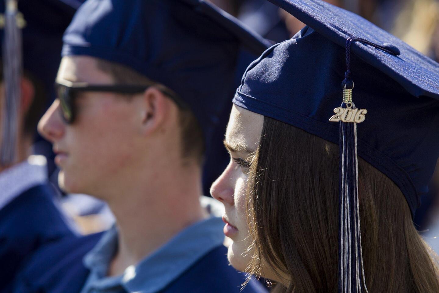 Alexis Grantz listens during the 2016 commencement ceremony for Newport Harbor High School at Orange Coast College on Thursday.