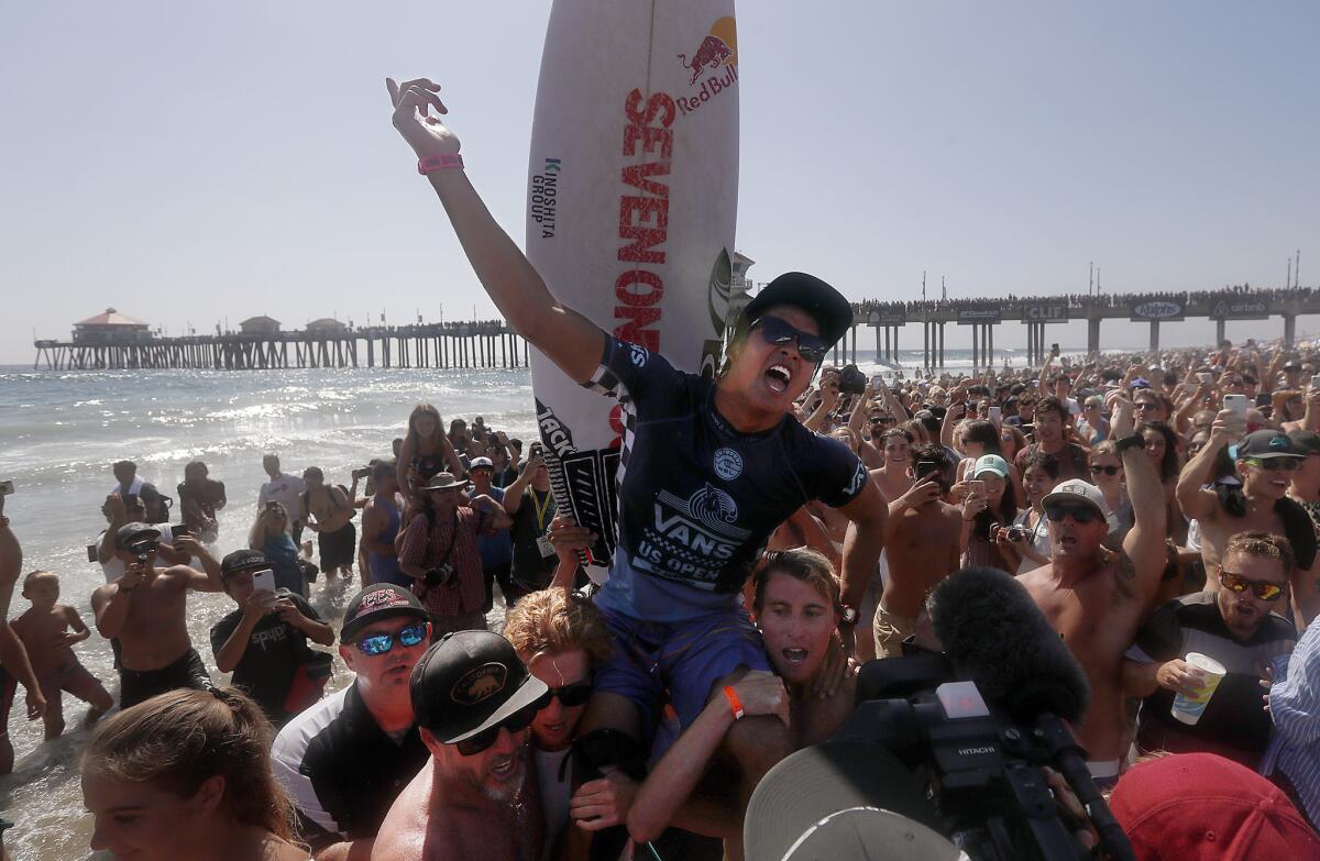 HUNTINGTON BEACH, CALIF. - AUG. 5, 2018. Kanoa Igarashi celebrates after defeating Griffin Colapinto in the finals of the 2018 Vans U.S, Open of Surfing on Sunday, Aug. 5, 2018, in Huntington Beach. (Luis Sinco/Los Angeles Times)