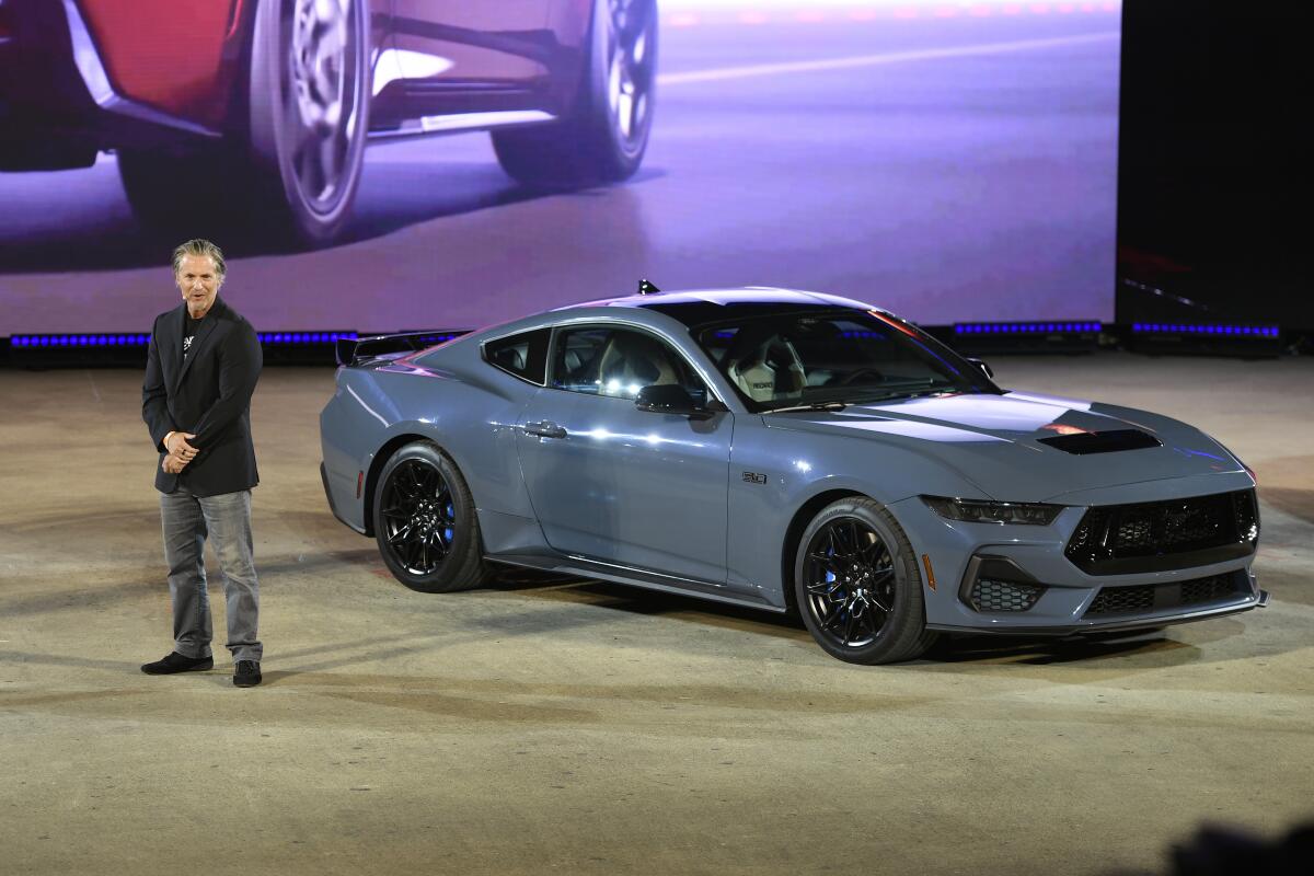 Ed Krenz, Ford Mustang Chief Engineer, talks about one of the models of the 2024 Ford Mustang at the North American International Auto Show, Wednesday, Sept. 14, 2022, in Detroit. (AP Photo/Jose Juarez)