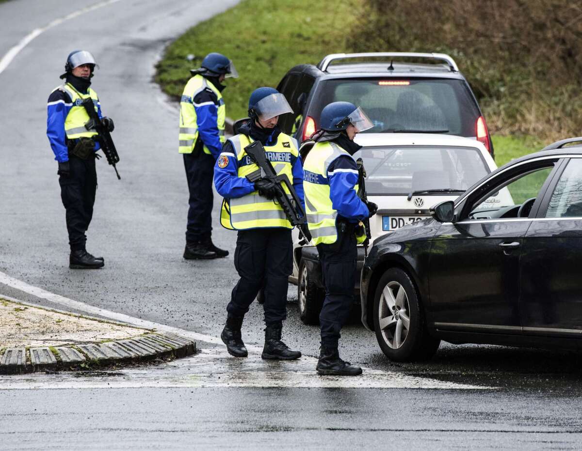 French gendarmes block the access to the city of Dammartin-en-Goele on January 9, 2015 where two brothers suspected of slaughtering 12 people in an Islamist attack on French satirical newspaper Charlie Hebdo held one person hostage as police cornered the gunmen. The hostage drama unfolded at a printing business in the small town of Dammartin-en-Goele, only 12 kilometres (seven miles) from Paris's main Charles de Gaulle airport, police sources said. AFP PHOTO / DENIS CHARLETDENIS CHARLET/AFP/Getty Images ** OUTS - ELSENT, FPG - OUTS * NM, PH, VA if sourced by CT, LA or MoD **