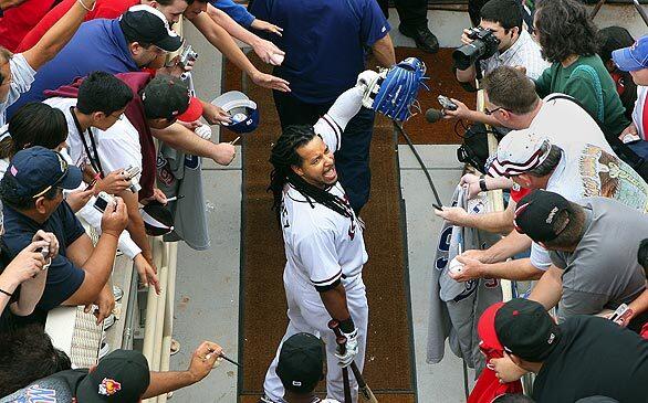 Manny Ramirez interacts with the Albuquerque fans before his first game since his suspension.