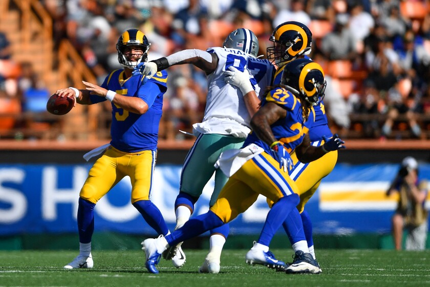 Rams quarterback Blake Bortles looks to throw to running back Darrell Henderson (27) on Saturday.