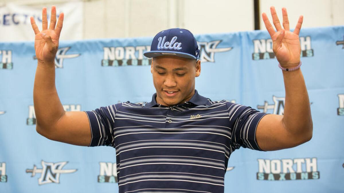 North Torrance High linebacker Mique Juarez announces his committment to UCLA during National signing day on Feb. 3.