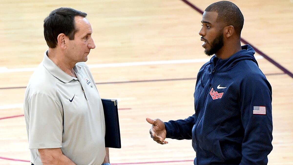 Clippers point guard Chris Paul chats with Duke Coach Mike Krzyzewski during a U.S. national basketball team practice on Tuesday at Mendenhall Center in Las Vegas.