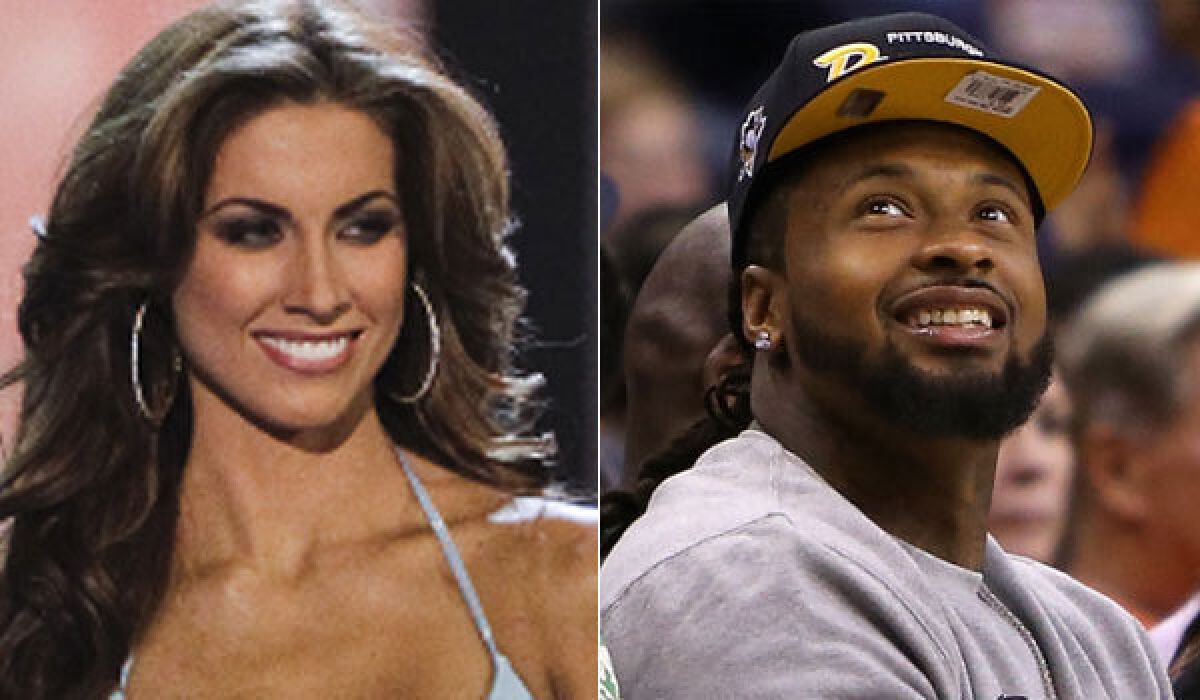 Arizona Cardinals defensive end Darnell Dockett, right, tweeted his phone number to Katherine Webb while her boyfriend, Alabama quarterback AJ McCarron, was playing in the BCS title game.