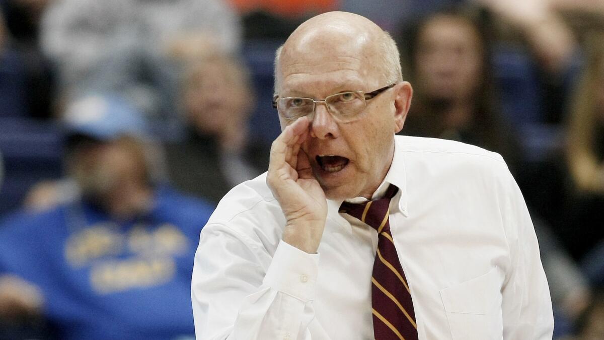 USC women's volleyball coach Mick Haley shouts instructions during a playoff match in December 2011.