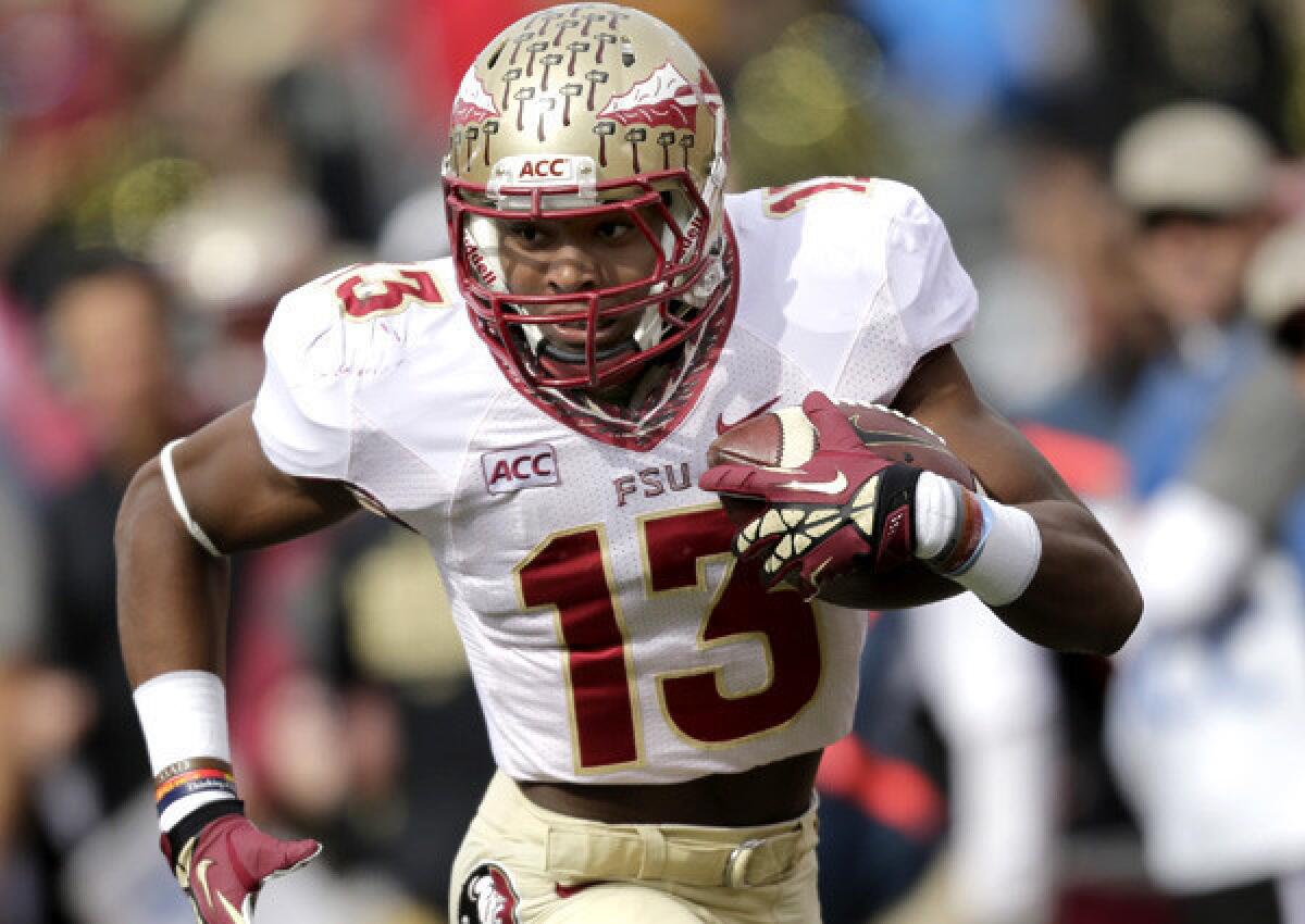 Florida State defensive back Jalen Ramsey runs back an interception for a touchdown against Wake Forest during an ACC game.