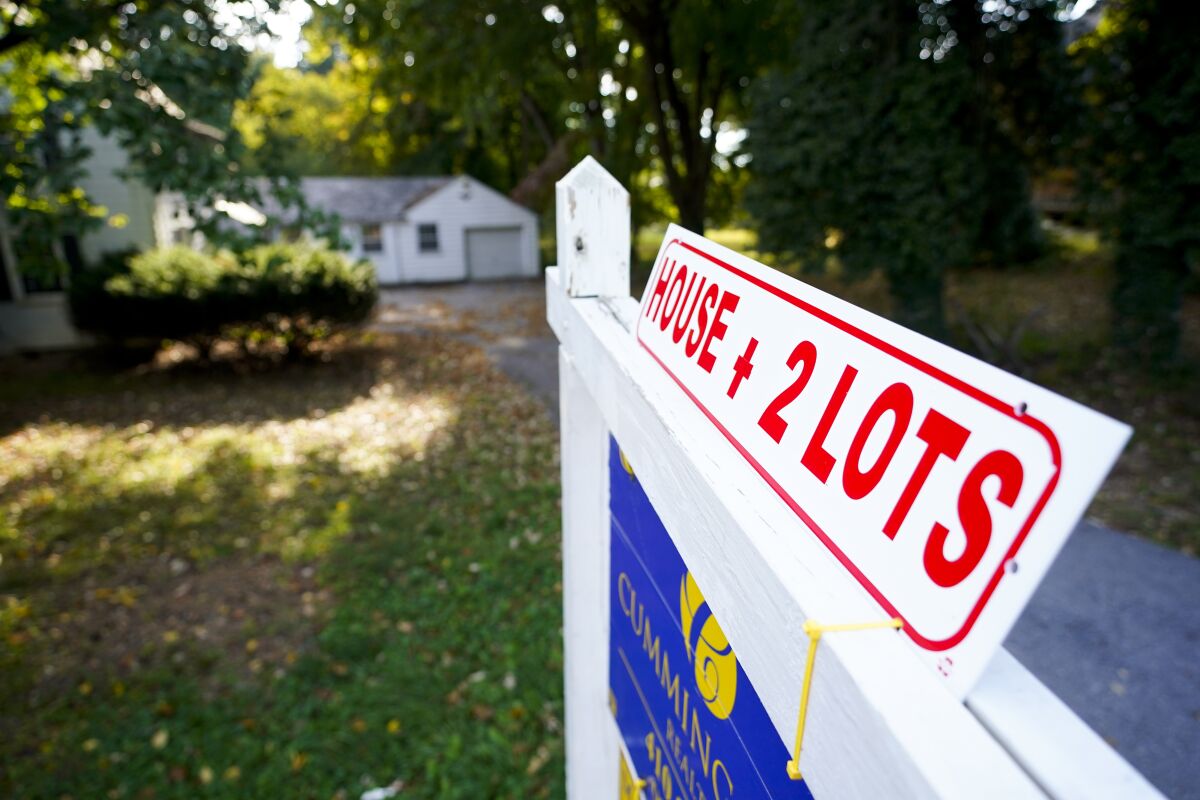 FILE - A for sale sign outside of a home, Wednesday, Oct. 12, 2022, in Towson, Md. On Thursday Freddie Mac reports on this week’s average U.S. mortgage rates. By Matt Ott. UPCOMING: 250 words after noon release. (AP Photo/Julio Cortez, File)