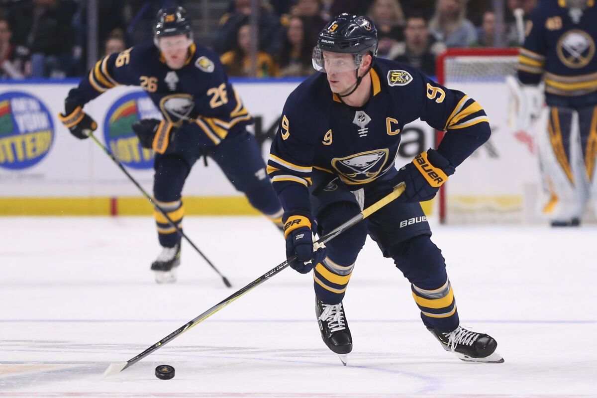 Buffalo Sabres forward Jack Eichel (9) skates with the puck during the first period of an NHL hockey game against the Columbus Blue Jackets, Saturday, Feb. 1, 2020, in Buffalo, N.Y. (AP Photo/Jeffrey T. Barnes)