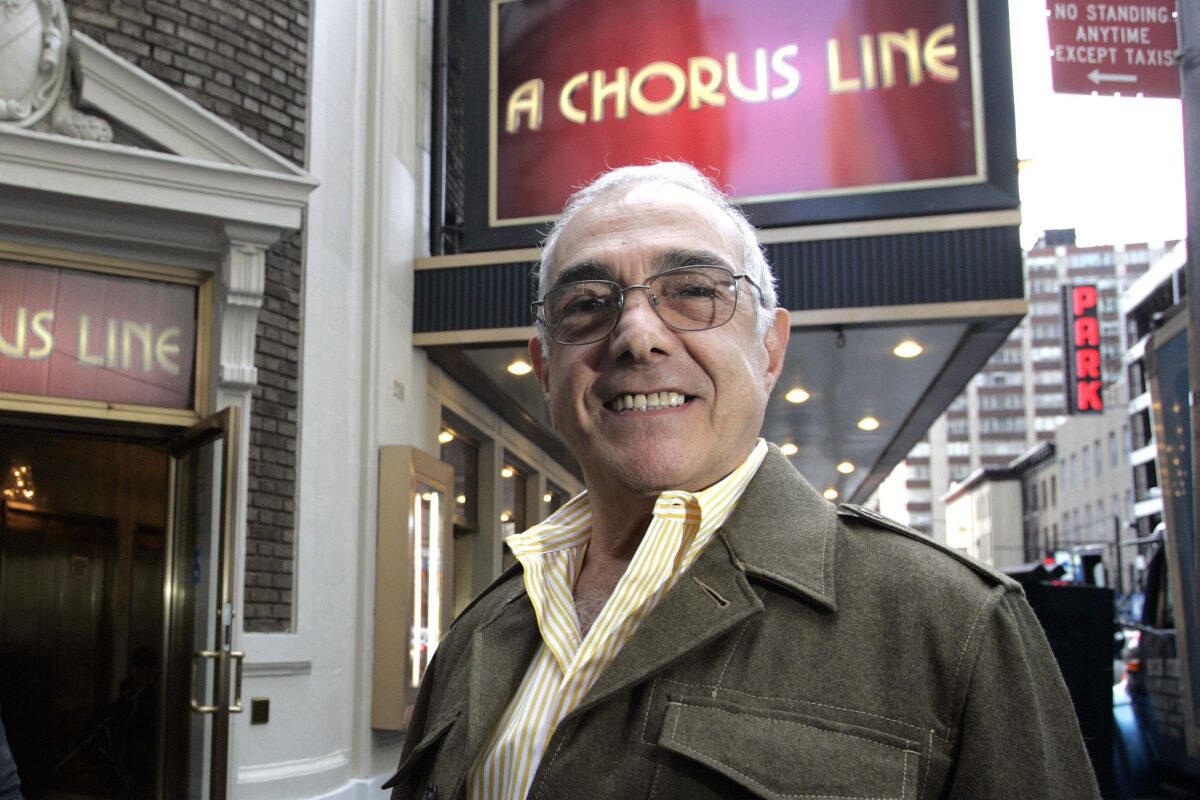 Choreographer Bob Avian stands outside the Gerald Schoenfeld Theatre on Broadway under a marquee for "A Chorus Line" in 2006