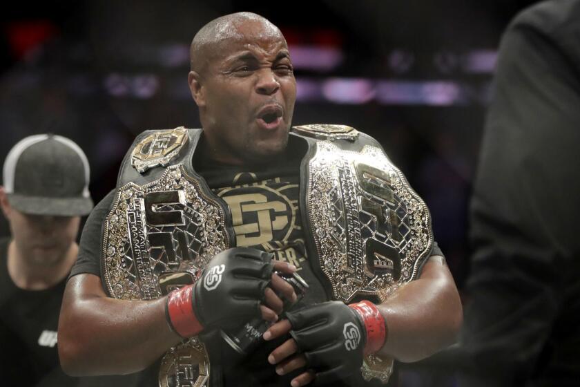 Daniel Cormier reacts after defeating Derrick Lewis by submission in the second round of a heavyweight mixed martial arts bout at UFC 230, early Sunday, Nov. 4, 2018, at Madison Square Garden in New York. (AP Photo/Julio Cortez)