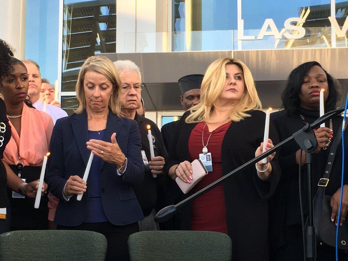 At a prayer vigil at Las Vegas City Hall, 59 candles were lit for Sunday's shooting victims.