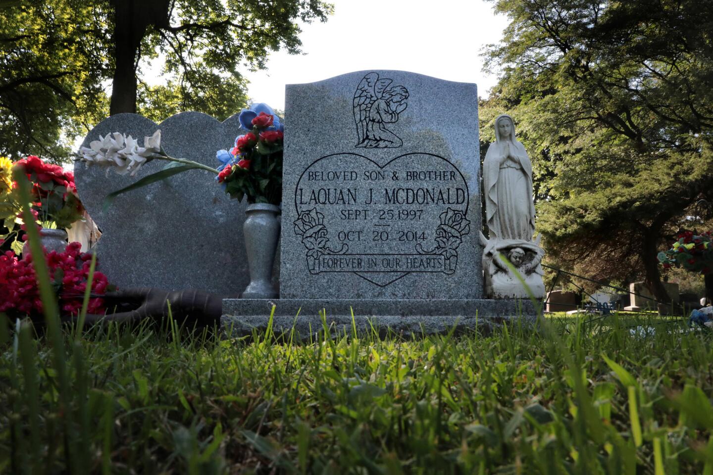 Afternoon light falls on the gravesite of Laquan McDonald at the Forest Home Cemetery in Forest Park on Sept. 13, 2018. Chicago police officer Jason Van Dyke is facing murder charges for the shooting McDonald.