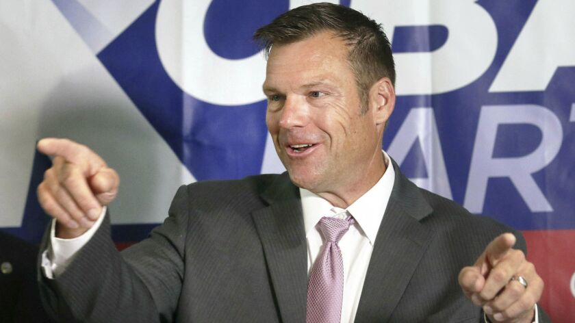 Kansas Secretary of State Kris Kobach, a candidate for governor, speaks at a news conference in Topeka, Kan., on Aug. 8.
