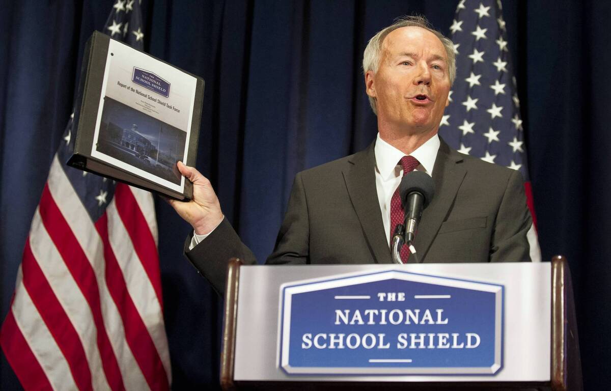Asa Hutchinson, a former Republican congressman from Arkansas, announces the National School Shield task force findings in a Washington news conference.
