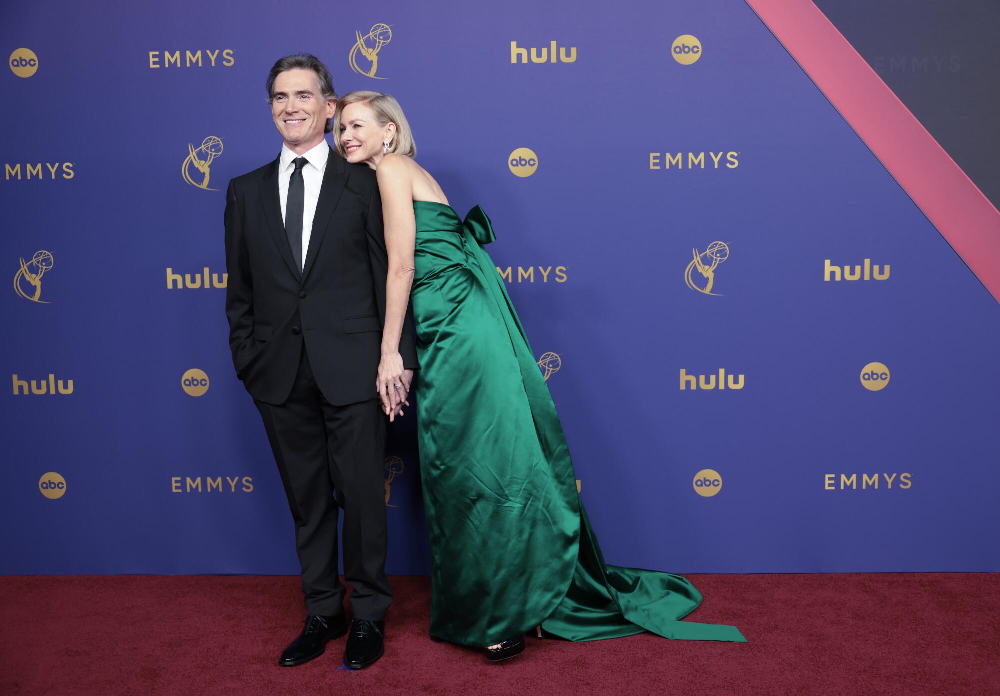 Billy Crudup and Naomi Watts hug on the red carpet.