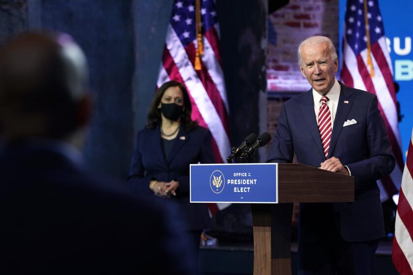 President-elect Joe Biden, accompanied by Vice President-elect Kamala Harris, speaks about economic recovery at The Queen theater, Monday, Nov. 16, 2020, in Wilmington, Del. (AP Photo/Andrew Harnik)