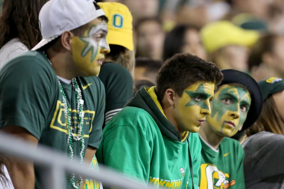 Downtrodden Oregon fans are seen during the second half of Saturday's 62-20 loss to Utah.