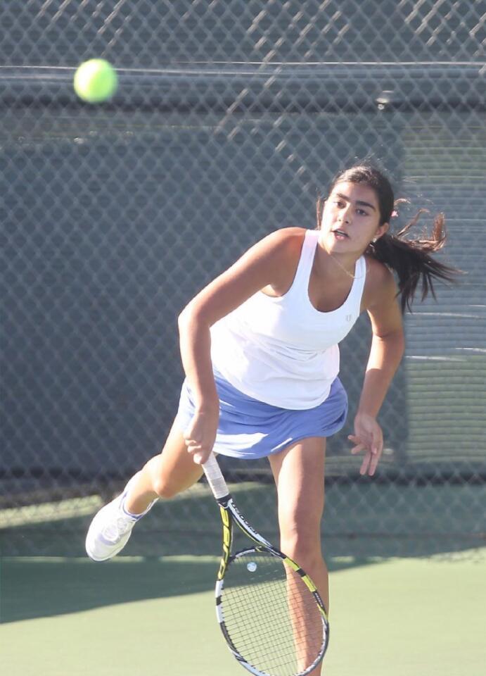Corona del Mar High's Camilla Edalat hits a serve against University.