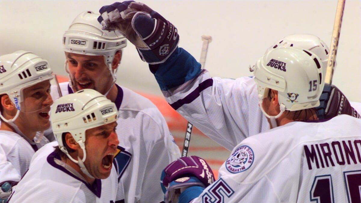Mighty Ducks players celebrate after a first-period goal in the first Stanley Cup playoff game in franchise history in 1997.